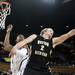 Western Michigan freshman Connar Tava reaches for a rebound in the first half against Michigan on Tuesday. Michigan leads at halftime 35-21. Daniel Brenner I AnnArbor.com